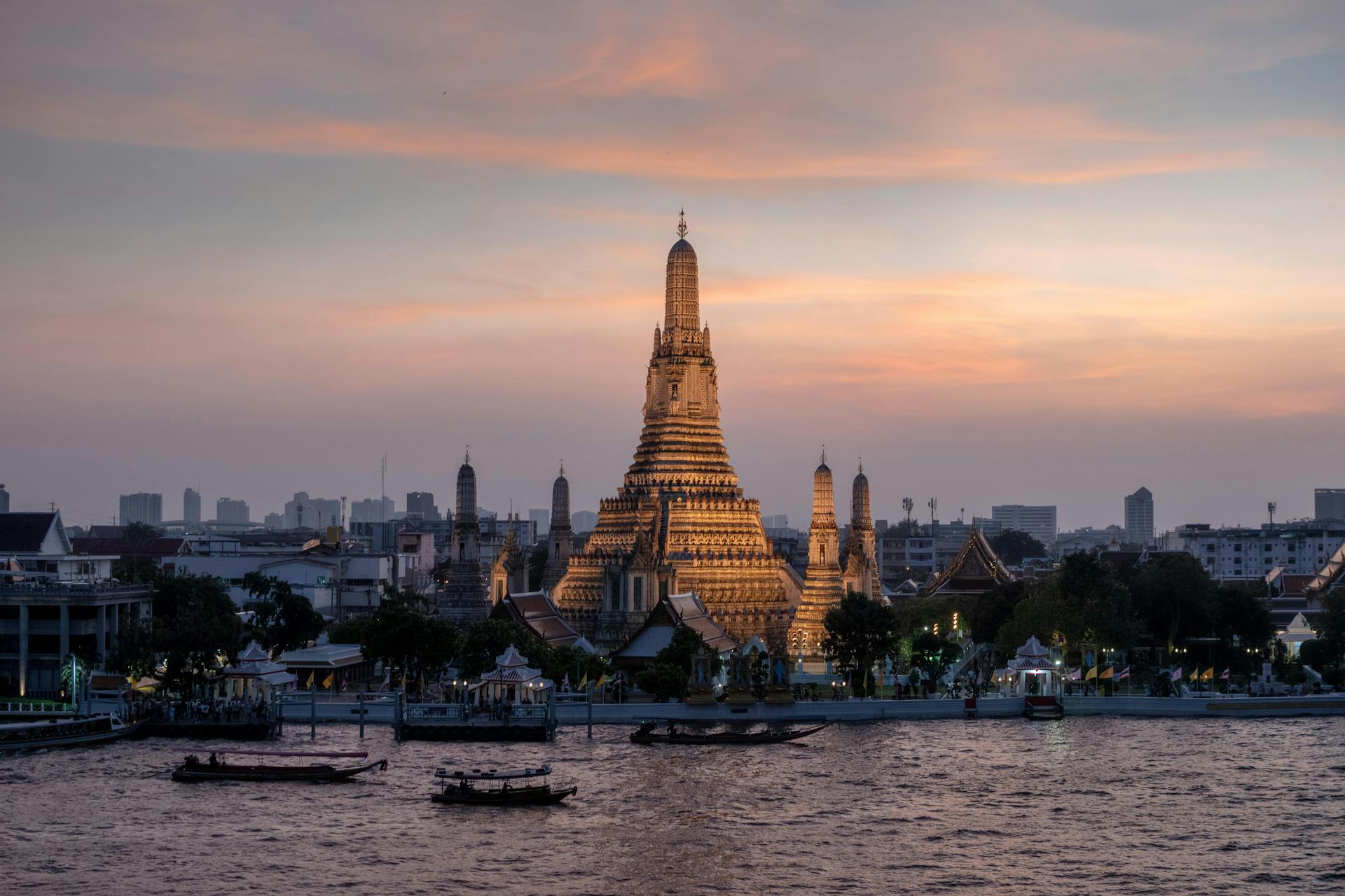 Iconic Bangkok Wat Arun at sunset for a vibrant Bangkok Travel banner with Legend Travel Group.